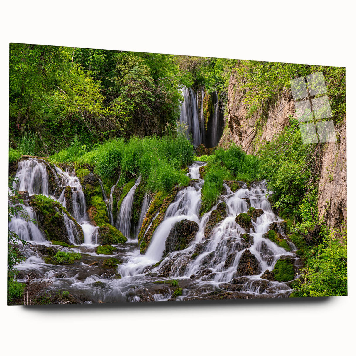 Acrylic glass wall art showcasing a serene waterfall landscape design, featuring vibrant colors and intricate details, perfect for enhancing modern interiors.