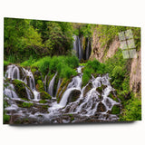 Acrylic glass wall art showcasing a serene waterfall landscape design, featuring vibrant colors and intricate details, perfect for enhancing modern interiors.
