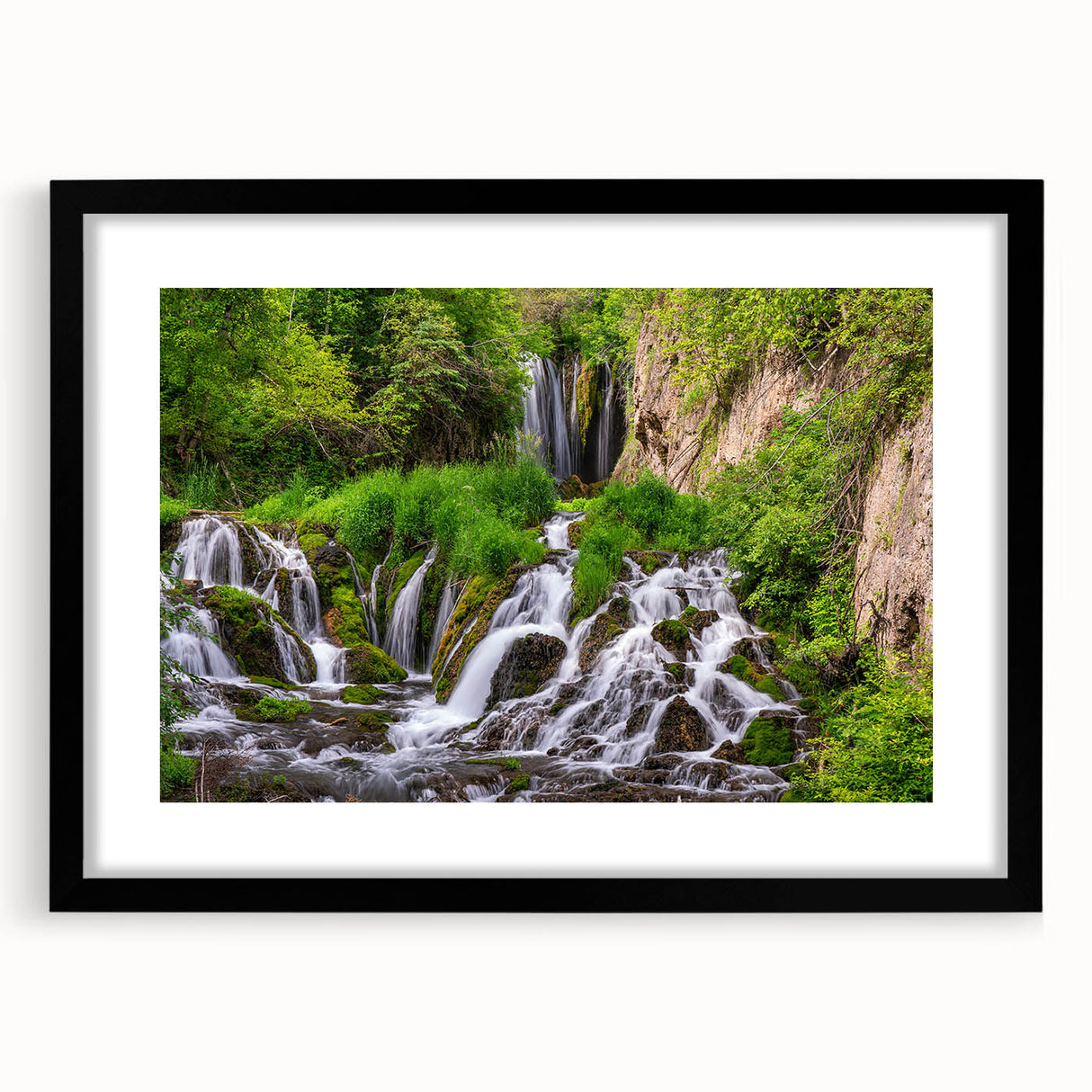 Framed wall art featuring a stunning waterfall landscape design, with a black mat and frame, perfect for enhancing home decor in living rooms or offices.