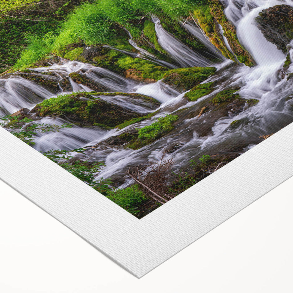 Serene landscape featuring a breathtaking waterfall cascading down rocky cliffs, surrounded by lush green foliage, perfect for home decor or nature-inspired art.