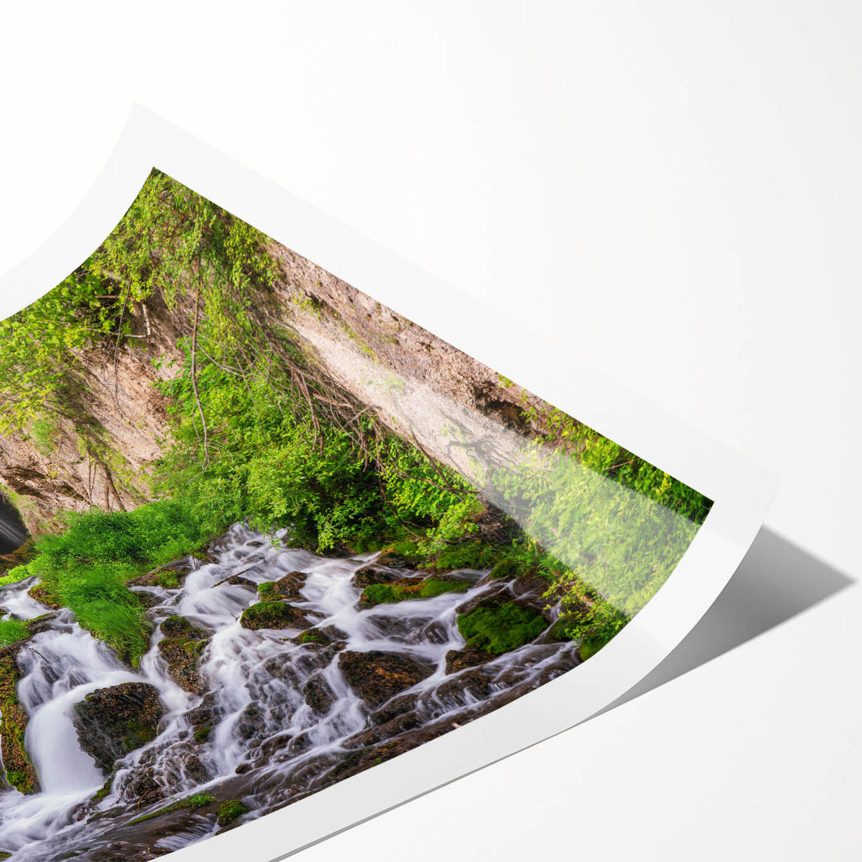 Vibrant wall art print showcasing a serene waterfall landscape, featuring lush greenery and cascading water, ideal for enhancing home decor aesthetics.