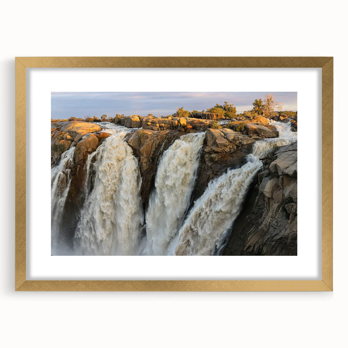 Framed wall art featuring a stunning waterfall landscape design, showcasing vibrant colors and intricate details, set in an elegant gold frame with a mat. Perfect for home decor enthusiasts seeking a serene natural focal point.