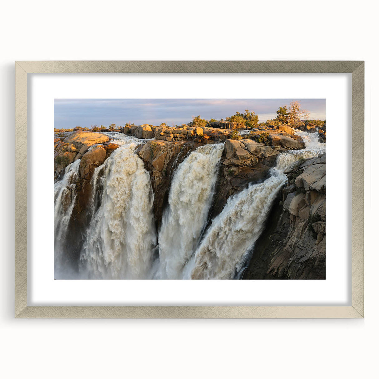Framed wall art collection showcasing a serene waterfall landscape design with a silver mat, perfect for enhancing home décor and bringing nature indoors.