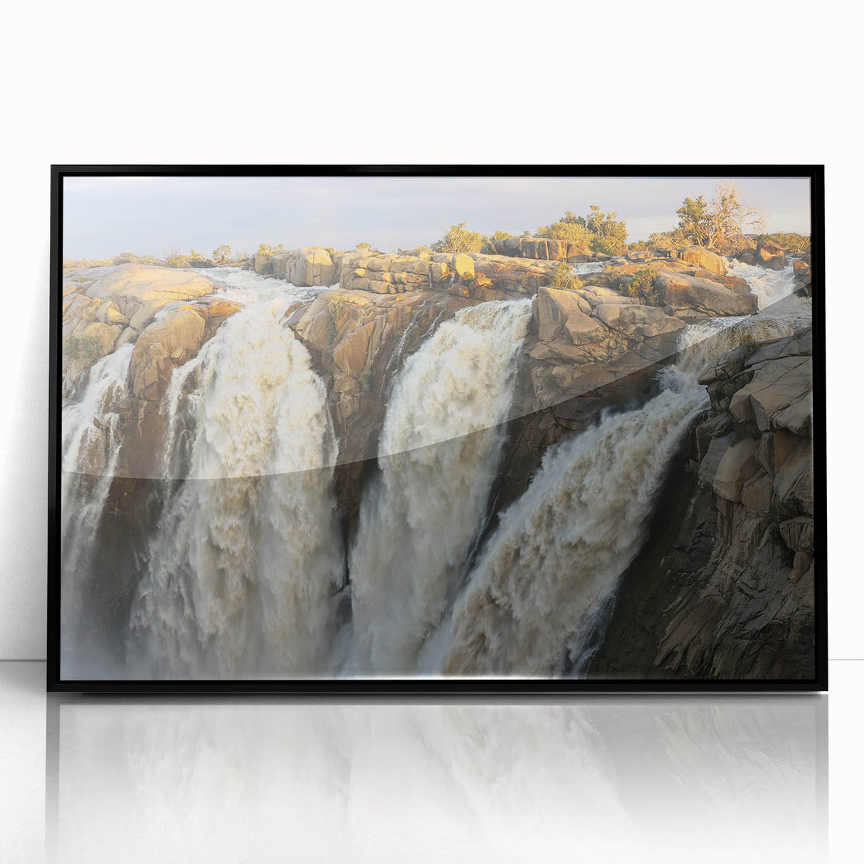 Framed acrylic wall art featuring a stunning landscape of cascading waterfalls, set against a black frame, perfect for modern home decor. Ideal for nature enthusiasts.
