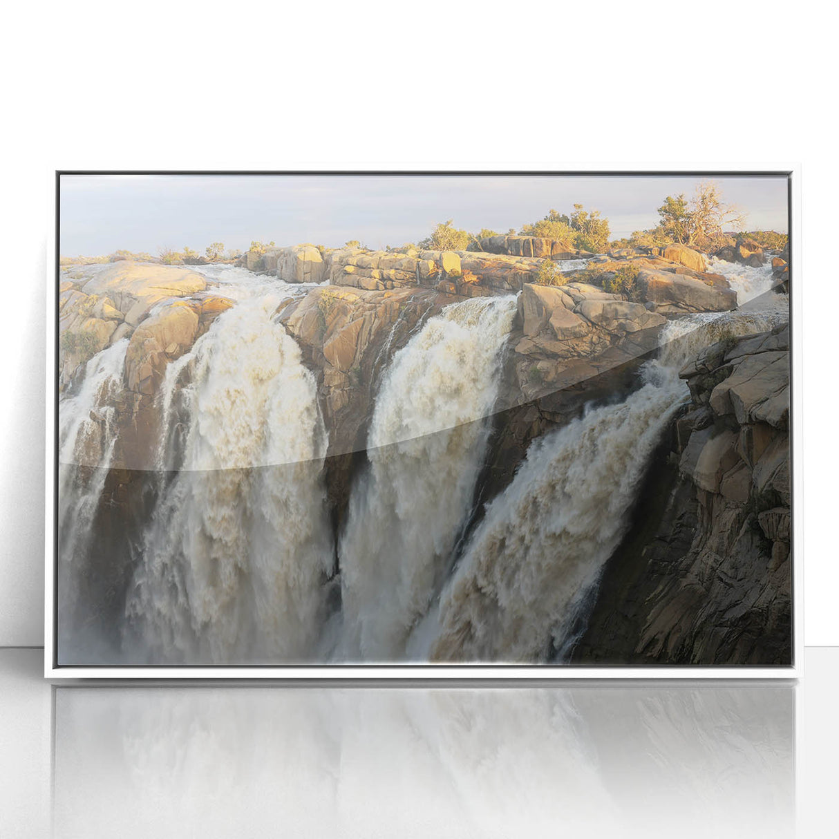 Framed acrylic wall art featuring a serene waterfall landscape design with lush greenery, perfect for home decor. Ideal for nature enthusiasts seeking tranquility.