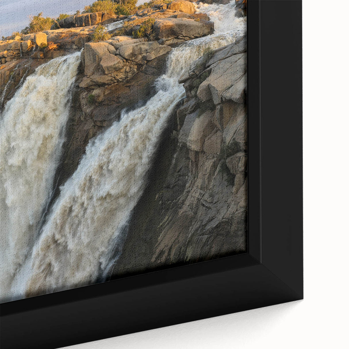 Framed canvas wall art showcasing a vibrant landscape of cascading waterfalls, featuring rich blues and greens, enhancing any home decor with a serene nature vibe.