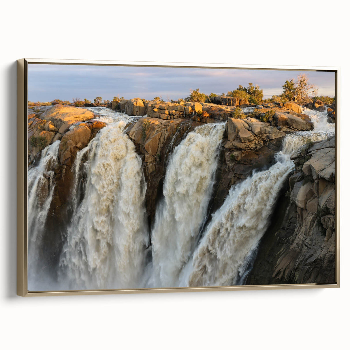 Framed canvas wall art showcasing a serene waterfall landscape design with vibrant colors, accented by a gold frame, ideal for enhancing home decor.