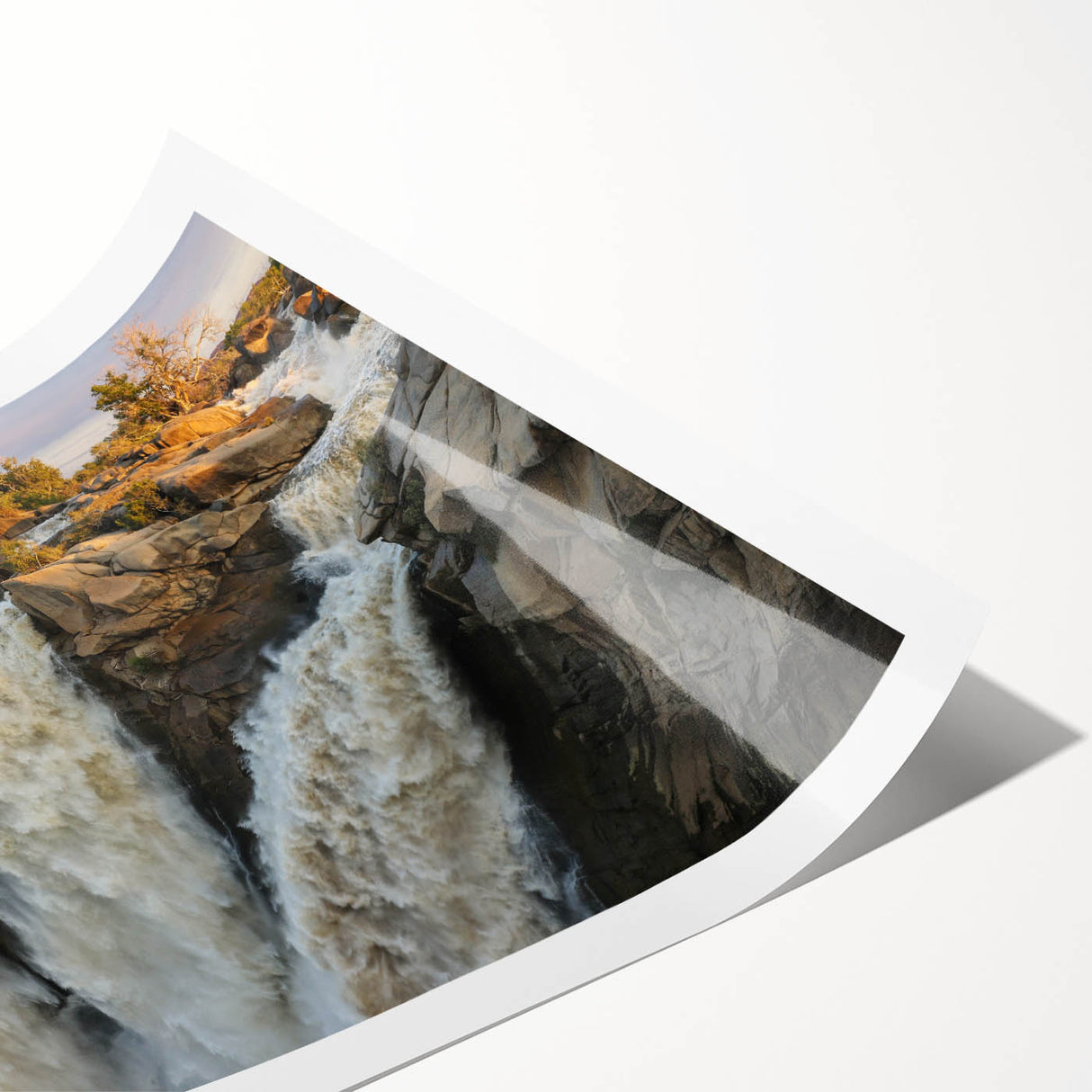 Vibrant landscape waterfall wall art print showcasing cascading water amidst lush greenery, rolled and ready for framing, perfect for home decor enthusiasts.
