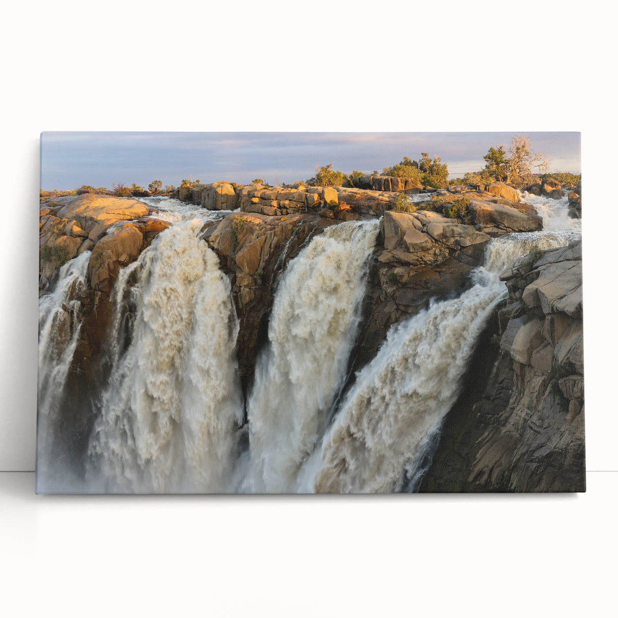 Stretched canvas wall art showcasing a serene waterfall landscape design with vibrant blues and greens, perfect for enhancing home decor and creating a calming atmosphere.