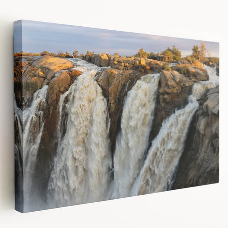 Stretched canvas wall art showcasing a vibrant waterfall landscape design, featuring rich blues and greens, perfect for enhancing home decor and creating a tranquil atmosphere.