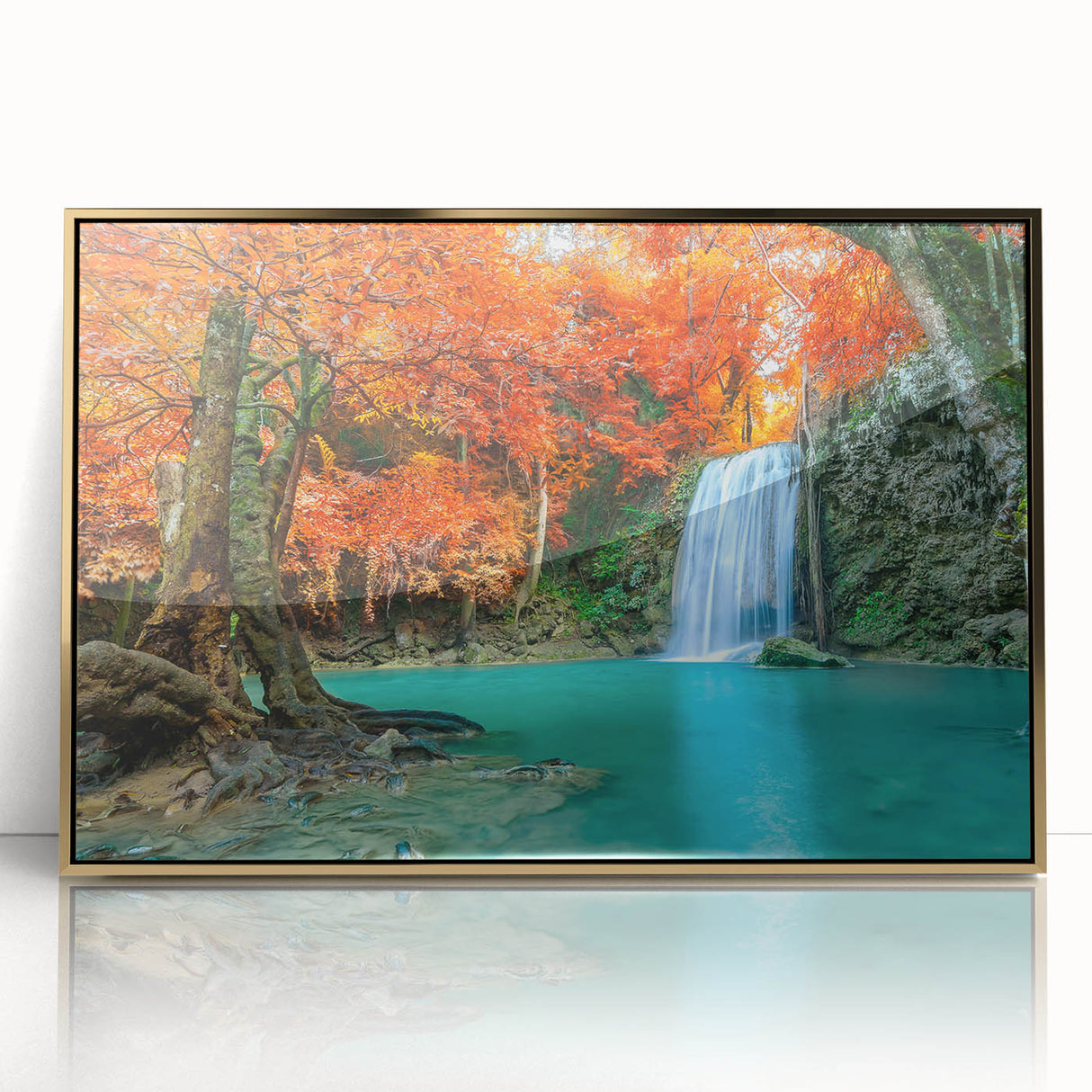 Framed wall art featuring a stunning waterfall landscape design, highlighted by vibrant colors and an elegant gold frame, perfect for enhancing home decor.