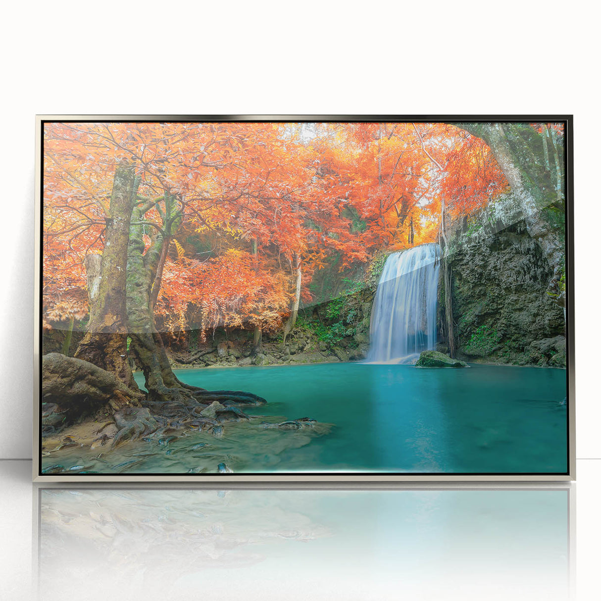 Framed acrylic wall art featuring a serene landscape with cascading waterfalls, surrounded by lush greenery and vibrant blue skies, perfect for home decor.