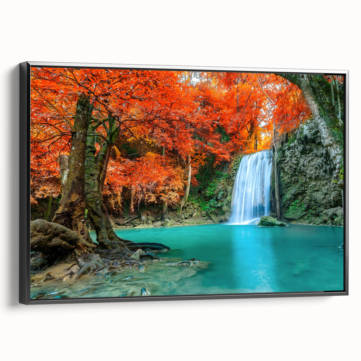 Framed canvas wall art showcasing a stunning landscape waterfall design with vibrant blues and greens, presented in a sleek black frame for modern decor.