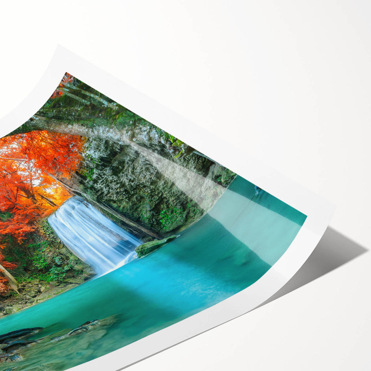Serene landscape wall art depicting a vibrant waterfall surrounded by lush greenery, printed on high-quality material and rolled for easy display. Perfect for nature lovers.