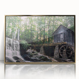 Framed wall art featuring a serene landscape of a watermill, highlighted with gold accents and a sleek acrylic front, ideal for enhancing home decor with nature-inspired elegance.