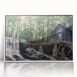 Framed acrylic wall art design showcasing a serene landscape with a watermill, presented in a modern white frame, perfect for home decor enhancement.
