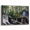 Framed canvas wall art showcasing a serene watermill landscape design in black, viewed from the side, perfect for enhancing home decor with a tranquil aesthetic.