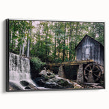 Framed canvas wall art showcasing a serene watermill landscape design in black, viewed from the side, perfect for enhancing home decor with a tranquil aesthetic.