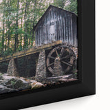 Framed canvas wall art depicting a serene watermill landscape, showcasing vibrant greens and blues, ideal for home decor and nature-inspired themes.