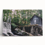 Stretched canvas wall art featuring a serene watermill landscape design, showcasing vibrant greenery and tranquil water reflections, perfect for home decor.
