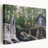 Stretched canvas wall art showcasing a tranquil watermill landscape, featuring vivid greens and blues, ideal for enhancing home decor with natural beauty.