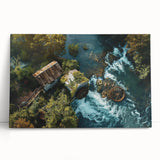 Stretched canvas wall art showcasing a serene watermill landscape, featuring lush greenery and a tranquil river setting, ideal for home decor.
