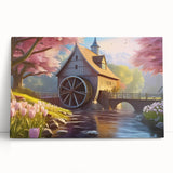Stretched canvas wall art showcasing a serene watermill landscape design, featuring soft green hues and gentle flowing water, ideal for home decor.