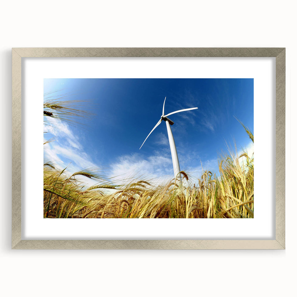 Framed wall art featuring a serene landscape with windmills, set in a stylish silver frame with a mat, perfect for home decor or office ambiance.