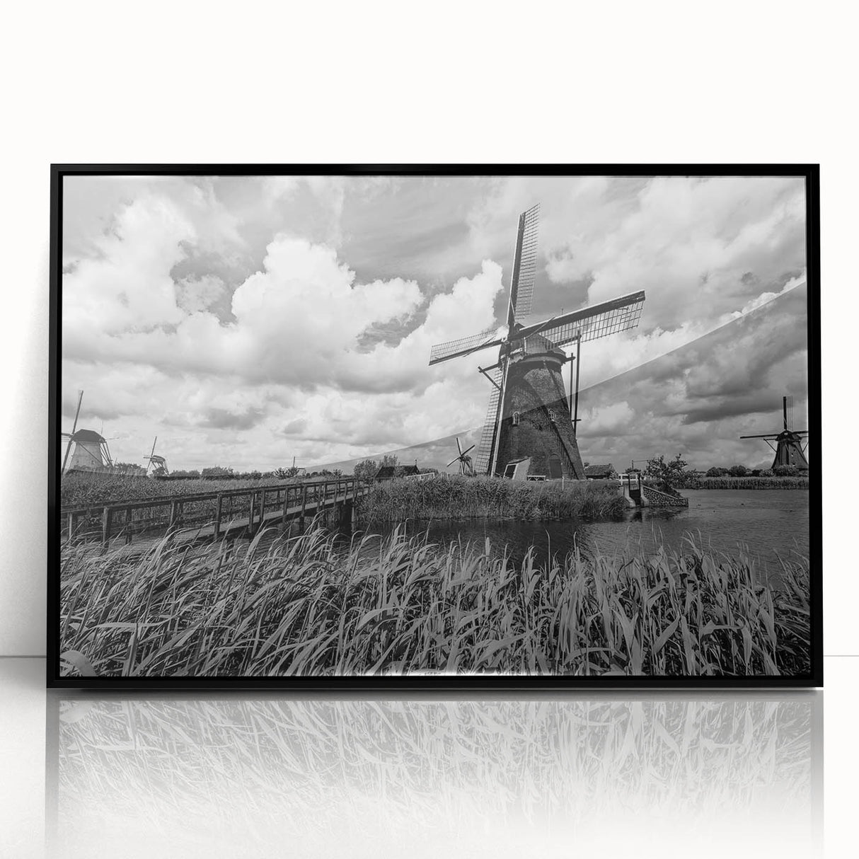 Framed acrylic wall art showcasing a scenic landscape with windmills, featuring a black frame and a vivid color palette, perfect for home decor.