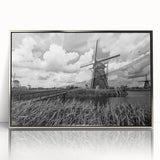 Framed wall art collection featuring a serene landscape with windmills, designed in a modern style with a sleek silver frame, ideal for home decor.
