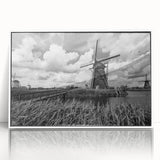 Framed acrylic wall art collection showcasing a picturesque landscape with windmills, featuring a white frame and vibrant colors, perfect for modern home decor.