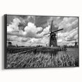 Framed canvas wall art showcasing a scenic landscape with windmills, designed in a modern style with a black frame, perfect for home decor.