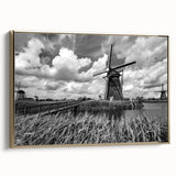 Framed canvas wall art showcasing a serene landscape with windmills, featuring a gold frame and a side view perspective, ideal for home decor enhancement.