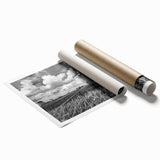 Rolled print showcasing a serene landscape with windmills and vibrant sky colors, ideal for home decor. Perfectly packaged in a protective tube for easy display.