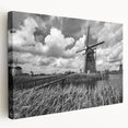 Stretched canvas wall art featuring a serene landscape with windmills, vibrant colors of blue and green, designed to enhance home decor and evoke tranquility.