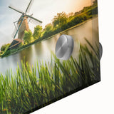 Close-up of a vibrant acrylic glass wall art piece showcasing a picturesque landscape with windmills, highlighting intricate details and vivid colors for home decor.