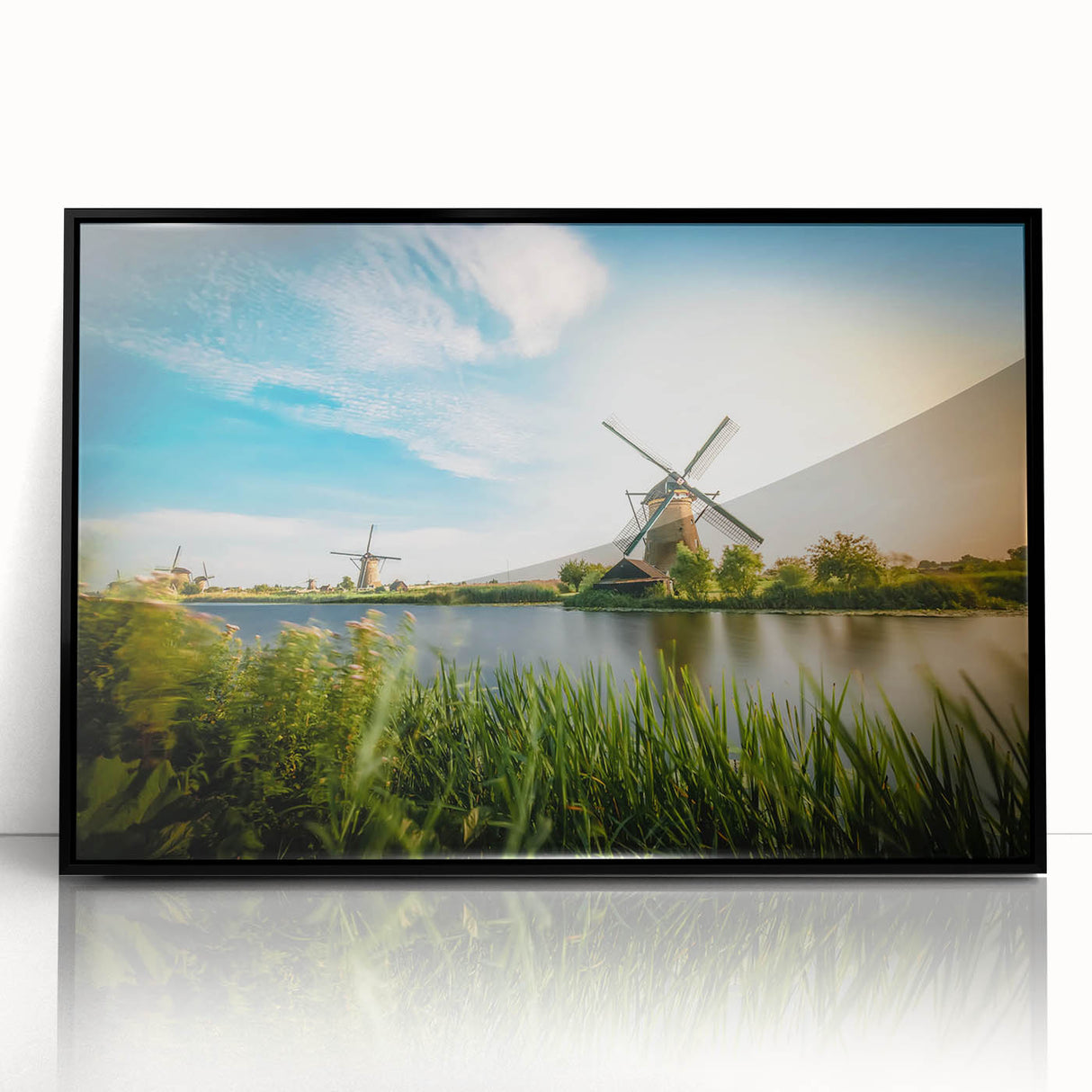 Framed acrylic wall art featuring a serene landscape with windmills, showcasing vibrant colors and intricate details, perfect for home decor enhancement.