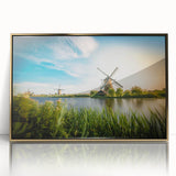 Framed acrylic wall art showcasing a scenic landscape with windmills, featuring gold accents and a modern design, ideal for enhancing home decor.