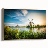 Framed canvas wall art showcasing a picturesque landscape with windmills against a serene sky, featuring a gold frame that adds elegance to home decor.