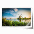 Rolled print showcasing a vibrant landscape of windmills against a dramatic sunset backdrop, perfect for home decor. Ideal for art enthusiasts seeking unique wall art.