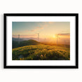 Framed wall art featuring a serene landscape with windmills, presented in a sleek black frame with a white mat, perfect for enhancing home decor and adding a touch of tranquility.