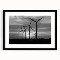 Black-framed wall art showcasing a serene landscape with windmills, designed with a modern aesthetic and featuring a white mat to enhance its elegance. This piece adds a touch of sophistication to any interior decor.