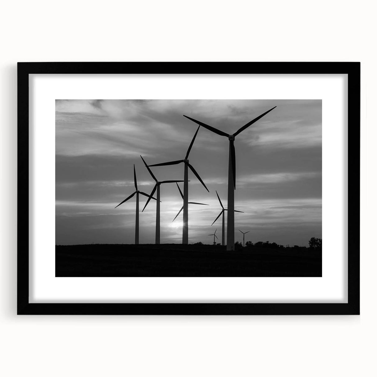 Black-framed wall art showcasing a serene landscape with windmills, designed with a modern aesthetic and featuring a white mat to enhance its elegance. This piece adds a touch of sophistication to any interior decor.