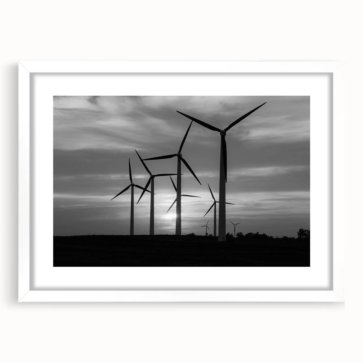 Framed wall art showcasing a serene landscape with windmills, featuring a white mat and sleek design, perfect for home decor and enhancing interior spaces.