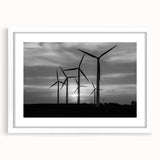 Framed wall art showcasing a serene landscape with windmills, featuring a white mat and sleek design, perfect for home decor and enhancing interior spaces.
