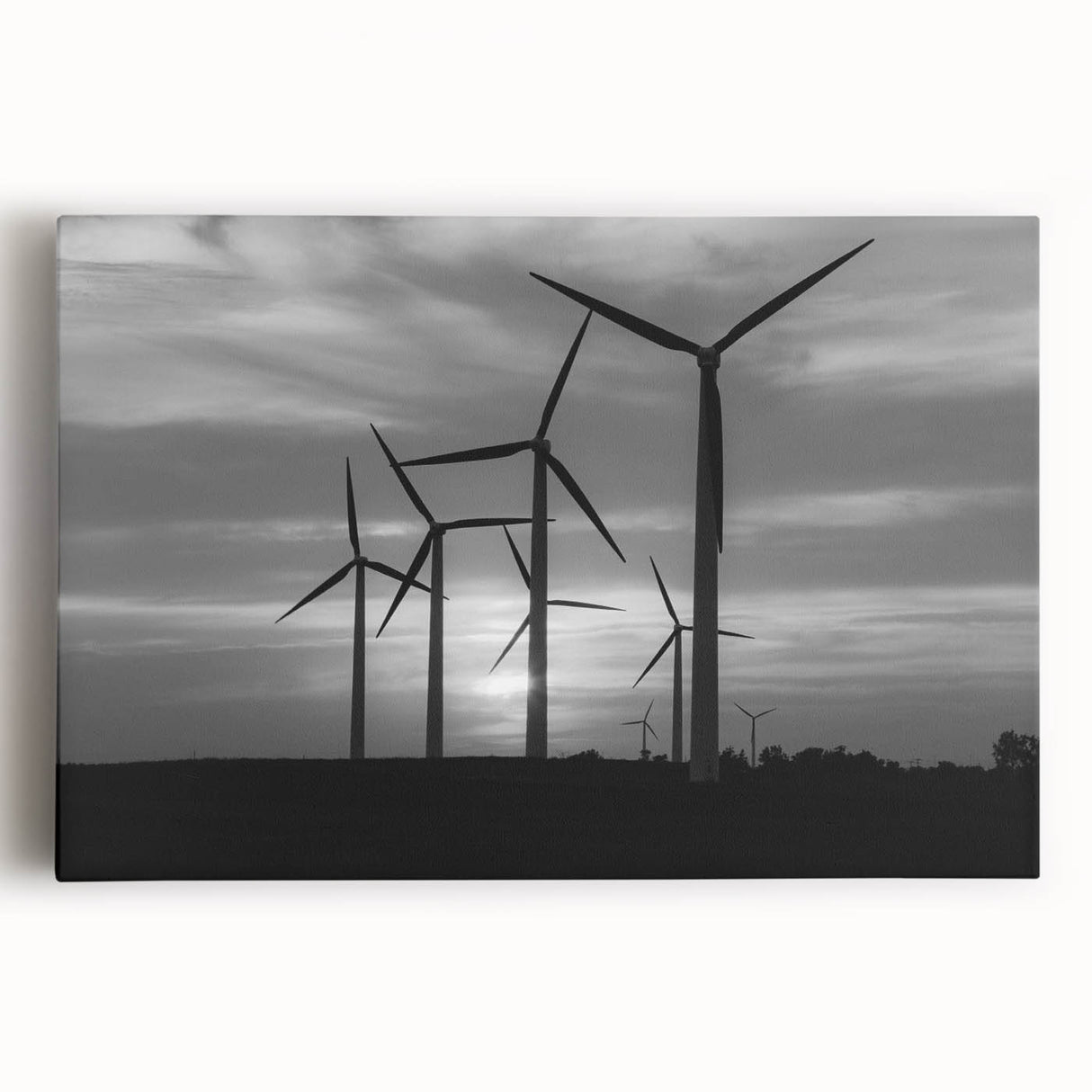 Vibrant landscape wall art featuring a serene view of windmills against a golden sunset sky, printed on stretched canvas for an elegant home decor accent.