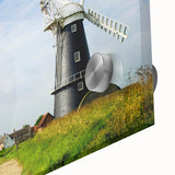 Close-up view of a vibrant acrylic wall art piece showcasing a serene landscape with windmills, blending natural hues and intricate designs for home decor.