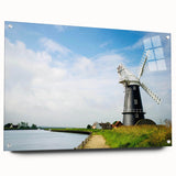 Acrylic glass wall art showcasing a vibrant landscape with windmills, designed for modern decor, featuring a side view with pins for easy hanging.