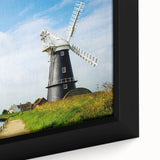 Framed canvas wall art showcasing a close-up of a serene landscape with windmills, featuring vibrant colors and intricate details, perfect for home decor.