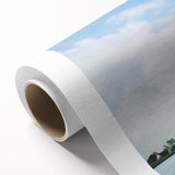 Rolled canvas artwork depicting a serene landscape with windmills against a vibrant sunset, showcasing rich colors and intricate details, ideal for home decor.